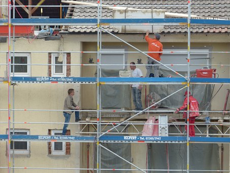 Men working on house under renovation